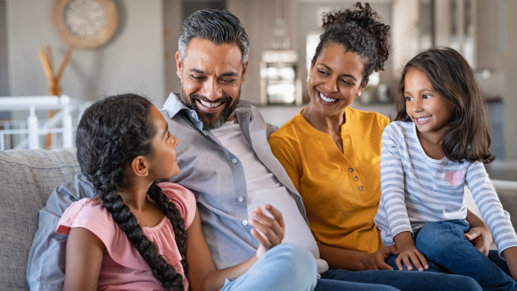 A joyful family sharing a happy moment together at home.