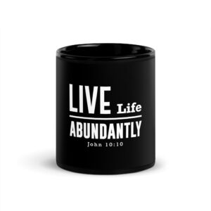 Black mug with inspirational Bible verse design.